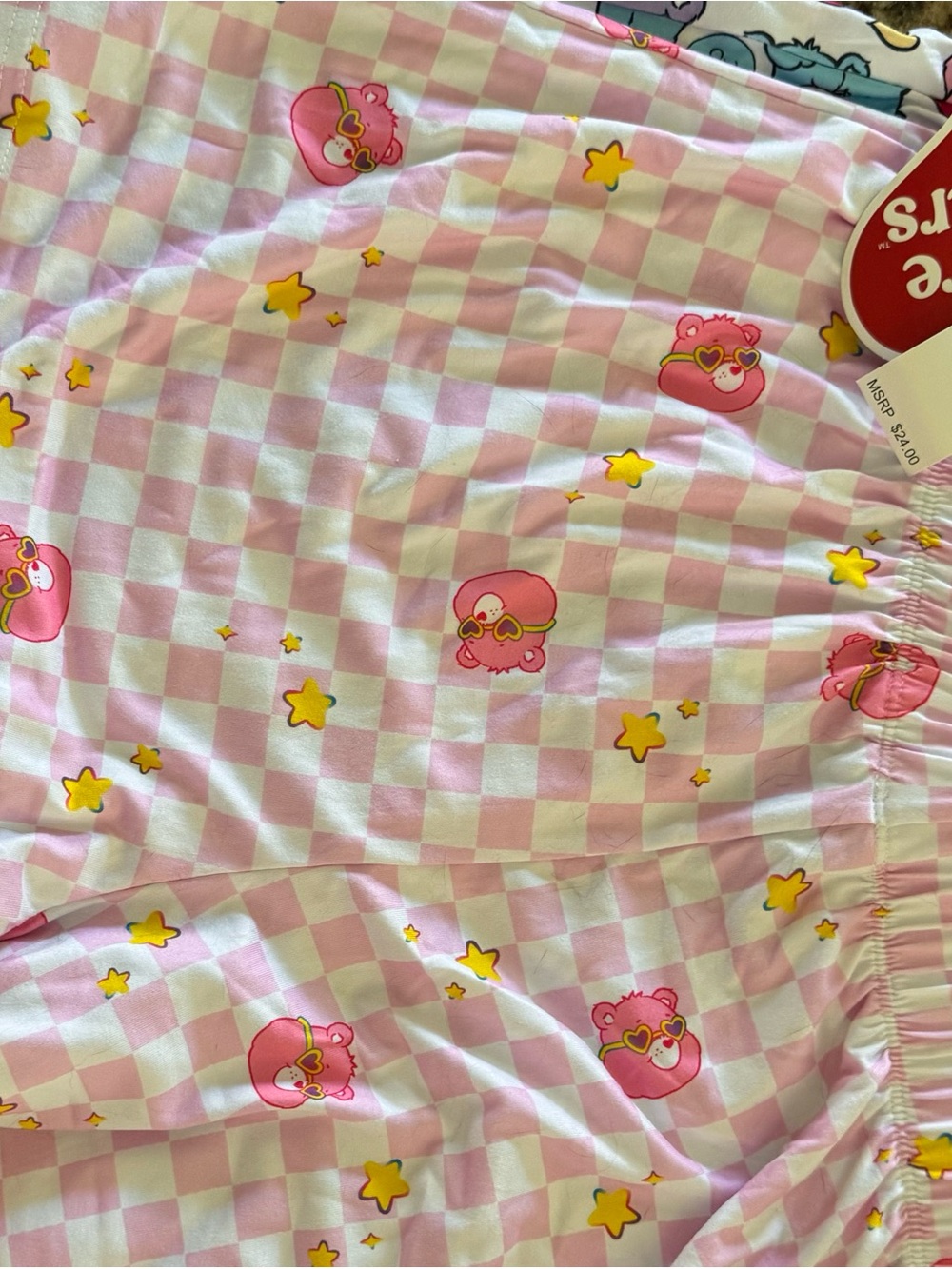Pink Checkerboard Star Care Bears Pajama shorts.